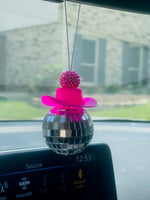 Load image into Gallery viewer, Disco ball with cowboy hat on it and pink bead, hanging from the car rearview mirror. Southern Charm Famhouse.