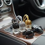 Load image into Gallery viewer, Three small perfume bottles and a pair of sunglasses on a car dashboard. Southern Charm Farmhouse