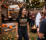 Load image into Gallery viewer, Woman in a Halloween-themed The Boys of Fall Villian shirt standing in a decorated backyard with people and decorations. Southern Charm Farmhouse.