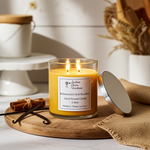 Load image into Gallery viewer, 2 wick hand poured Butterscotch and Bourbon Candle on a wooden surface, surrounded by cinnamon sticks and vanilla beans. Southern Charm Farmhouse.