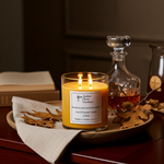 Load image into Gallery viewer, 2 wick hand poured Butterscotch and Bourbon Candle on a tray with a decanter and leaves, warm lighting. Southern Charm Farmhouse.