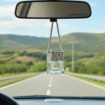 Load image into Gallery viewer, Car air freshener hanging from a mirror with a scenic road view outside. Southern Charm Farmhouse.