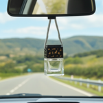 Load image into Gallery viewer, Car air freshener hanging from a rearview mirror with a scenic road in the background. Southern Charm Farmhouse.