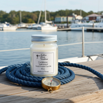 Load image into Gallery viewer, 16 oz hand poured Caribbean Teakwood Candle jar on a dock with blue rope and compass, marina background. Southern Charm Farmhouse.