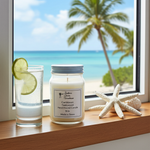 Load image into Gallery viewer, 16 oz hand poured Caribbean Teakwood Candle and glass with lime on a windowsill with a beach view. Southern Charm Farmhouse.