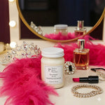 Load image into Gallery viewer, 16 oz hand poured Diva Candle, lipstick, and perfume on a vanity table with decorative items. Southern Charm Farmhouse.