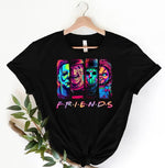 Load image into Gallery viewer, Black t-shirt with colorful 'Friends' from Horror Movies graphic design on a hanger. Southern Charm Farmhouse.