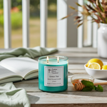 Load image into Gallery viewer, 2 wick hand poured Green Tea Turquoise candle on a wooden surface with a book and lemons in the background. Southern Charm Farmhouse.