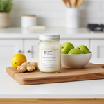 Load image into Gallery viewer, 16 oz Hand poured Candle labeled 'Hawaiian Ginger' on a wooden cutting board with lemons, ginger, and apples in the background. Southern Charm Farmhouse.