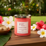 Load image into Gallery viewer, 2 wick hand poured Pink Hawaiian Ginger candle on a wooden surface surrounded by tropical flowers and ginger roots. Southern Charm Farmhouse.
