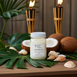 Load image into Gallery viewer, Jar of 'Jamaica Me Crazy' hand poured 16 oz Mason jar candle on a wooden surface with coconuts, shells, and plants in the background. Southern Charm Farmhouse