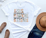 Load image into Gallery viewer, White t-shirt with colorful text 'Jesus, flannel, pumpkins, sweaters, blessings' on a white background with a hat and shoes. Southern Charm Farmhouse.