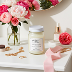Load image into Gallery viewer, 16 oz Mason jar labeled Love Spell hand poured Candle with decorative elements, pink and white flowers on a white surface. Southern Charm Farmhouse.