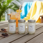 Load image into Gallery viewer, Three handpoured 4 oz jars of candles on a wooden surface with a drink and sunglasses in the background. Southern Charm Farmhouse
