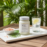 Load image into Gallery viewer, 16 oz Mason jar hand poured Pink Sands Candle, bowl of pink salt, and glass of lemon water on a tray with a natural background. Southern Charm Farmhouse.