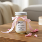 Load image into Gallery viewer, Pink Sugar Candle in a 16 oz Mason jar with pink ribbon on a living room table. Southern Charm Farmhouse.