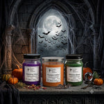 Load image into Gallery viewer, Three Halloween-themed candles on a rustic wooden table with pumpkins and bats in the background. Southern Charm Farmhouse