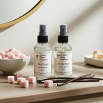 Load image into Gallery viewer, One Room spray and One Linen Spray bottle labeled 'Pink Sugar' and 'Vanilla Bean' on a wooden surface with pink sugar cubes and vanilla beans. Southern Charm Farmhouse.
