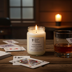 Load image into Gallery viewer, 16 oz mason jar Midnight Rider Candle with a label, glass of whiskey, and playing cards on a wooden table. Southern Charm Farmhouse.
