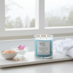 Load image into Gallery viewer, 2 wick hand poured Candle labeled 'Sea Salt & Orchid' on a windowsill with a bowl of sea salt and a pink orchid. Southern Charm Farmhouse.