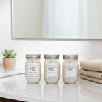 Load image into Gallery viewer, Three hand poured 4 oz jars of candles with labels on a white surface, with a plant and folded towels in the background. Southern Charm Farmhouse.