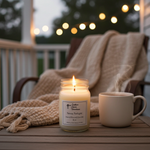 Load image into Gallery viewer, 16 oz hand poured Texas Twilight Candle and mug on a wooden table with string lights in the background. Southern Charm Farmhouse.