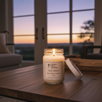 Load image into Gallery viewer, Texas Twilight hand poured Candle in a mason jar on a wooden table with a sunset view through large windows. Southern Charm Farmhouse.