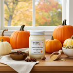 Load image into Gallery viewer, Hand poured Candle labeled 'Toasted Pumpkin Spice' on a table with pumpkins and spices in front of a window with autumn foliage. Southern Charm Farmhouse.