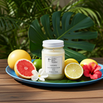 Load image into Gallery viewer, 16 oz Mason Jar of Hand poured Volcano candle on a tray with fruits and flowers, surrounded by green leaves. Southern Charm Farmhouse.