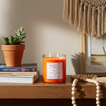 Load image into Gallery viewer, 2 Wick hand poured Volcano Candle on a wooden surface next to books and a plant, with a neutral wall and decorative items in the background. Southern Charm Farmhouse.