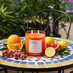 Load image into Gallery viewer, 2 Wick hand poured Volcano candle on a decorative table with fruits and a plant in the background. Southern Charm Farmhouse.