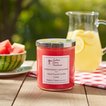 Load image into Gallery viewer, 2 Wick Candle labeled 'Watermelon Lemonade' from Southern Charm Farmhouse on a table with watermelon and lemonade. Southern Charm Farmhouse.