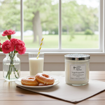 Load image into Gallery viewer, Hand poured 2 Wick Candle, glass of milk with a straw, donuts, and pink flowers on a table with a window view. Sprinkles on the candle lid. Sugar and Sprinkles candle. Southern Charm Farmhouse.