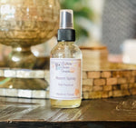 Load image into Gallery viewer, A bottle of 'Fall Room Spray' with a spray nozzle, placed on a surface. The label indicates the scent is 'Hazel Witch' and the product is made in Texas. Southern Charm Farmhouse.