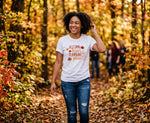 Load image into Gallery viewer, Person wearing a white t-shirt with autumn-themed text in a forest setting. Southern Charm Farmhouse.
