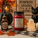 Load image into Gallery viewer, A Halloween-themed tabletop scene with a red hand poured candle in a 16 oz mason jar labeled 'Bite Me' as the main product, alongside a small amber bottle labeled 'Witches Elixir,' a black cat figurine, a white ghost lamp, pumpkins, autumn leaves, and a sign reading 'Pumpkins Spooks &amp; Books.'. Southern Charm Farmhouse.
