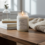 Load image into Gallery viewer, Candle in a jar labeled 'Black Sea' on a wooden surface with books and a plant in the background. Southern Charm Farmhouse
