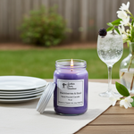 Load image into Gallery viewer, 16 oz hand poured mason jar Blackberries &amp; Basil candle. Sitting outside with sparkling water, white flowers and white plates. Southern Charm Farmhouse.
