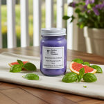 Load image into Gallery viewer, 16 oz hand poured mason jar candle labeled 'Blackberries &amp; Basil' on a wooden surface with basil leaves and grapefruit slices. Southern Charm Farmhouse.
