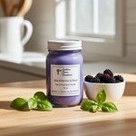 Load image into Gallery viewer, 16 oz hand poured mason jar candle labeled 'Blackberries &amp; Basil' on a wooden surface with a bowl of blackberries and basil leaves. Southern Charm Farmhouse.
