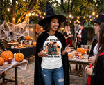Load image into Gallery viewer, Woman in  Halloween Shirt that says the boys are back in town with halloween villians riding in a scooby doo van with Halloween-themed shirt at a festive outdoor gathering.  Southern Charm Farmhouse.
