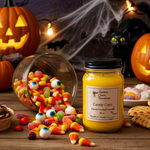 Load image into Gallery viewer, Halloween-themed hand poured candle labeled Candy Corn with candy corns candy and pumpkins in the background. Southern Charm Farmhouse
