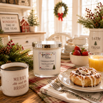 Load image into Gallery viewer, A hand-poured candle in a clear glass jar with a silver lid sits on a holiday-themed table setting. The label reads 'Christmas Cheer' and 'Hand Poured Candle' by 'Southern Charm Farmhouse.
