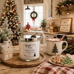 Load image into Gallery viewer, A hand-poured candle labeled 'Christmas Cheer' by Southern Charm Farmhouse. sits on a wooden tray in a cozy, decorated holiday kitchen.
