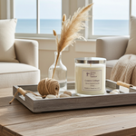 Load image into Gallery viewer, 2 wick hand poured Coastal Cottage Candle with decorative elements on a wooden tray in a living room setting. Southern Charm Farmhouse.
