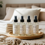 Load image into Gallery viewer, Four room spray bottles on a wooden tray with a blanket and towels next to it and pillows in the background. Southern Charm Farmhouse.
