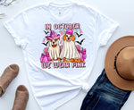 Load image into Gallery viewer, White t-shirt with graphic design of dogs in costumes and text 'In October We Wear Pink' on a white background. Southern Charm Farmhouse.
