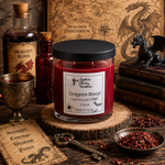 Load image into Gallery viewer, A hand-poured candle in a clear glass jar with a black lid sits on a wooden slice in a styled tabletop scene. The label reads 'Southern Charm Farmhouse.
