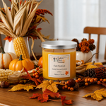 Load image into Gallery viewer, A hand-poured candle in a clear glass jar with a silver lid sits on a wooden table surrounded by autumn decorations including pumpkins, corn, leaves, and berries. The candle label reads and 'Fall Festival'. Southern Charm Farmhouse.
