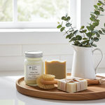 Load image into Gallery viewer, Green Tea 16 oz Mason jar hand poured Candle, soap, and scrub brush on a wooden tray with a plant in the background. Southern Charm Farmhouse
